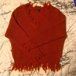 Distressed knit sweater